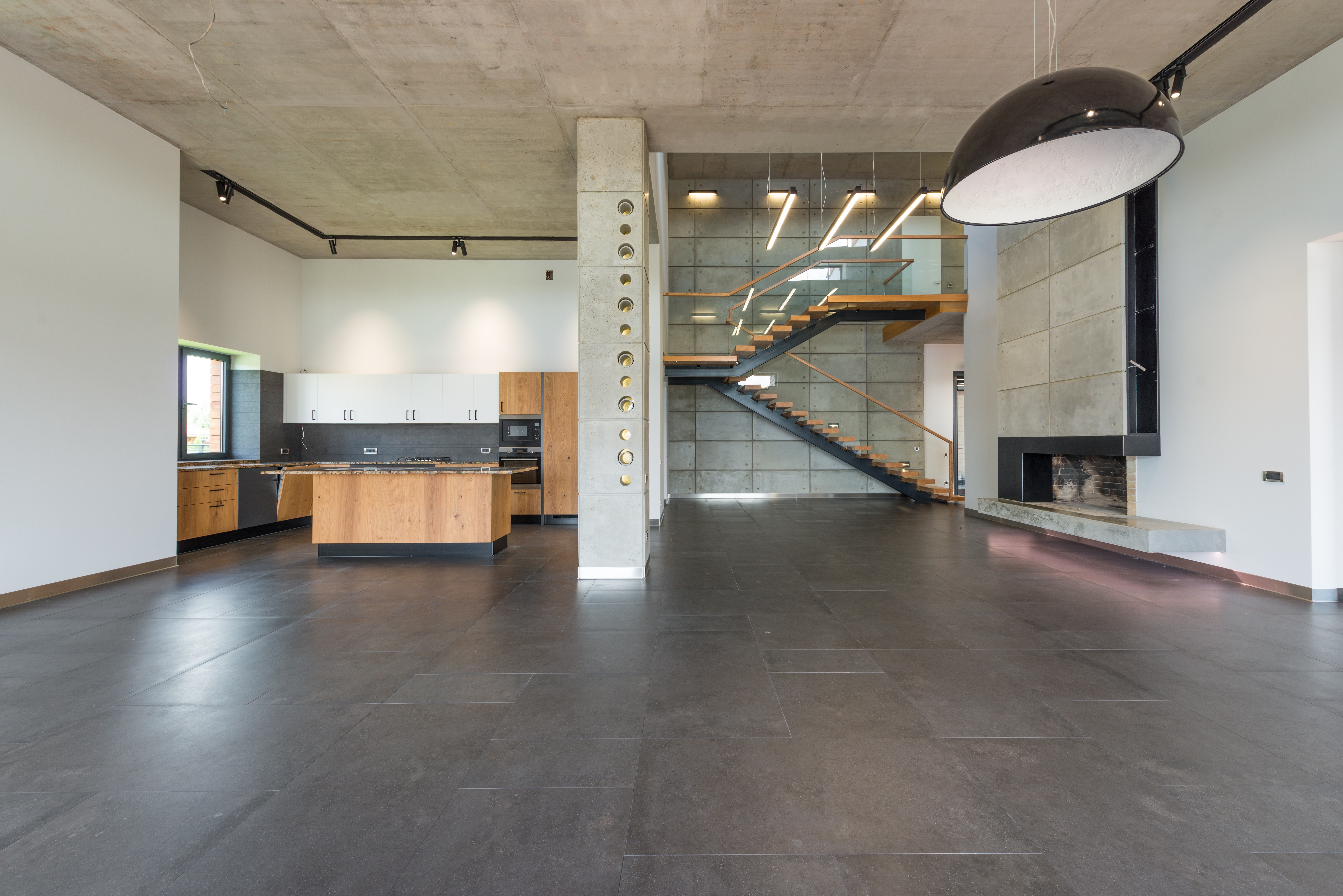 Fireplace + Staircase feature wall with concrete cladding